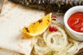 Lemon close-up. grilled mackerel. Serving on a wooden Board on a rustic table. Barbecue restaurant menu, a series of Royalty Free Stock Photo