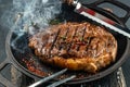 grilled marbled beef steak striploin with spices in a grill pan. place for text, top view Royalty Free Stock Photo