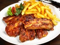Fine Meat - Grilled Marinated Pork Spareribs with French Fries Royalty Free Stock Photo
