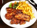 Fine Meat - Grilled Marinated Pork Spareribs with French Fries Royalty Free Stock Photo