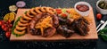 Grilled meat on the board. Sausage, ribs and fresh vegetables. On a wooden table. Royalty Free Stock Photo