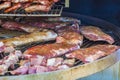 Grilled meat. Close-up cooking of large juicy pieces of raw, fat, natural, marinated pork meat, beef calves, rams on a griddle Royalty Free Stock Photo