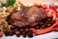 Grilled meat cooked with nuts and vegetables Royalty Free Stock Photo