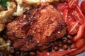 Grilled meat cooked with nuts and vegetables Royalty Free Stock Photo
