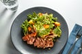 Grilled meat duck with roasted pumpkin and fresh green salad Royalty Free Stock Photo