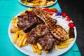 Grilled meat with fries , meat cutlets Croatian dish