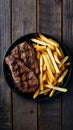 Grilled meat and fries presented enticingly on a wooden table