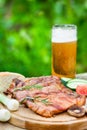 Grilled meat with glass of beer