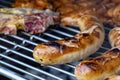 Grilled meat on the grill, german sausages or bratwurst