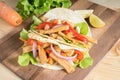 Grilled meat with onion and bell peppers, tomato,lettuce and serve with flour tortilla on wooden board. Royalty Free Stock Photo