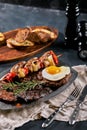 Grilled meat platter. Assorted delicious grilled meat with vegetables. Grilled mixed meat with pepper sauce and Royalty Free Stock Photo