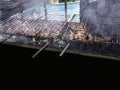 Grilled meat roasted skewers barbecue. Barbeque churrasco meat background. Appetizing meat roasted BBQ grill outdoor