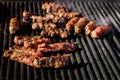 Grilled meat rolls called Mici or Mititei, traditional fresh Romanian barbeque grill food cooked on the barbeque at a street food Royalty Free Stock Photo