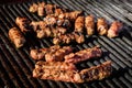 Grilled meat rolls called Mici or Mititei, traditional fresh Romanian bbq grill food cooked on the barbeque at a street food marke Royalty Free Stock Photo