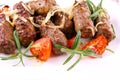 Grilled meat rolls with tomato and rosemary Royalty Free Stock Photo