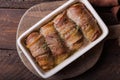 Grilled meat rolls wrapped in strips of bacon. Pork roll filled Royalty Free Stock Photo