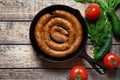 Grilled meat sausage in cast iron pan homemade traditional food