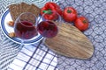 Grilled meat sausages with fresh vegetables. Two glasses of red wine Royalty Free Stock Photo