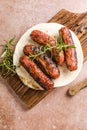 Grilled meat sausages. Fried sausage. Grilling food, bbq, barbecue. place for text, top view Royalty Free Stock Photo