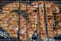 Grilled meat sausages on the grill. Process of cooking on coals. Barbecue. Close-up. Royalty Free Stock Photo