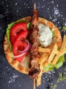 Grilled meat skewer on a pita bread, top view Royalty Free Stock Photo