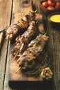 Grilled meat on skewers. BBQ meat with sauce. Royalty Free Stock Photo