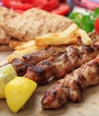 Grilled meat skewers on a table, closeup view Royalty Free Stock Photo