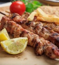 Grilled meat skewers on a table, closeup view Royalty Free Stock Photo