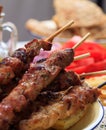 Grilled meat skewers on a table, closeup view Royalty Free Stock Photo