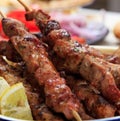 Grilled meat skewers on a table, closeup view Royalty Free Stock Photo