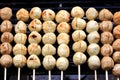 Grilled meatballs on bamboo sticks