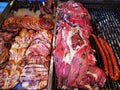 Grilled meats - sausages, pork and grilled chicken - smoked sheep on the right grill