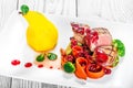 Grilled medium rare beef with pear, grilled vegetables, broccoli, berries sauce on plate on wooden background Royalty Free Stock Photo