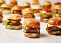 Grilled mini hamburgers with vegetables and cheese on light table.Macro.AI Generative