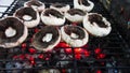 Grilled mushrooms on the hot flaming charcoal grill