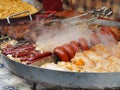 Grilled mutton, sausages with vegetables Royalty Free Stock Photo