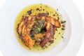 Grilled octopus with olive oil on a plate