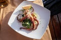 Grilled octopus on a plate with mashed potatoes and spinach Royalty Free Stock Photo