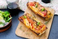 Grilled open faced sandwich with tomato, olives, cheese and chic Royalty Free Stock Photo