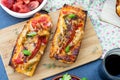 Grilled open faced sandwich with tomato, olives, cheese and chic Royalty Free Stock Photo