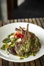 Grilled organic lamb chops meal with chimichurri sauce in argentina Royalty Free Stock Photo