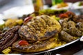 Grilled oriental Egyptian food, meatloaf Hawawshi , with stuffed grape leaves, yellow basmati rice