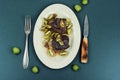 Grilled ostrich steak with kiwi berries