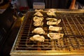 Grilled oysters as street food in Shanghai