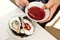 Grilled oysters with cranberry sauce