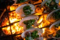 Grilled Oysters on fire with oil, green onion, roasted peanut