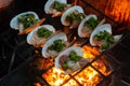 Grilled Oysters on fire with oil, green onion, roasted peanut