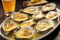 grilled oysters on half-shell with golden garlic sauce
