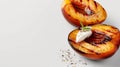 Grilled peaches with a dollop of cream and sprinkled with herbs on a white surface