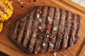 Grilled piece of beef with a crystalline salt, pepper and grille